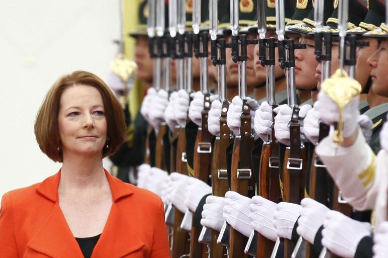 Prime Minister Julia Gillard inspects an honour guard during an official welcoming ceremony (Reuters: Petar Kujundzic)