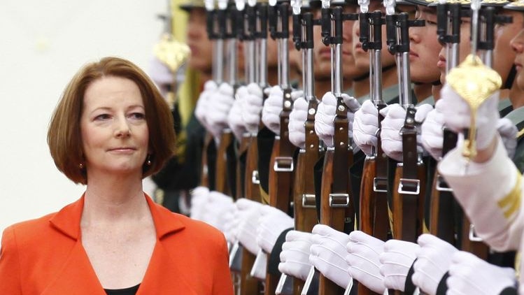 Prime Minister Julia Gillard inspects an honour guard during an official welcoming ceremony (Reuters: Petar Kujundzic)