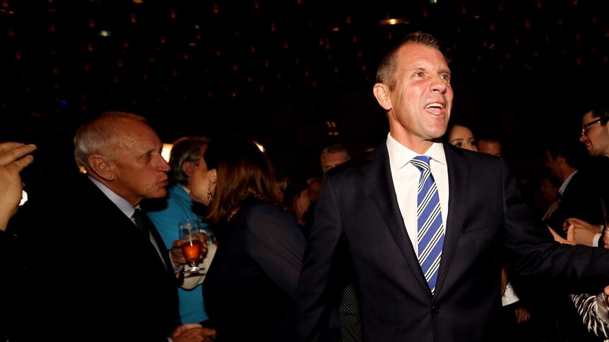 NSW Premier Mike Baird celebrates victory at the state elections