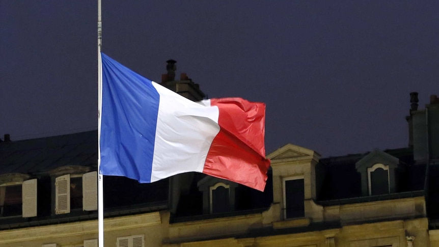A French flag flies half-mast
