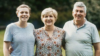 Portrait of Bobby Hendry and her parents, Chris and Peter Harrison for a story about Bobby's teachers becoming her parents.