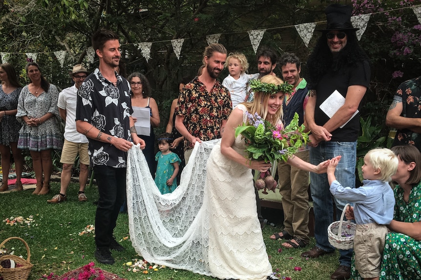 A bride high-fives a child in a story about women getting married without partners.