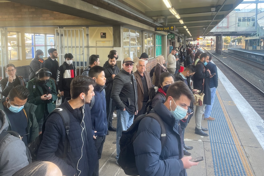 People waiting at train station