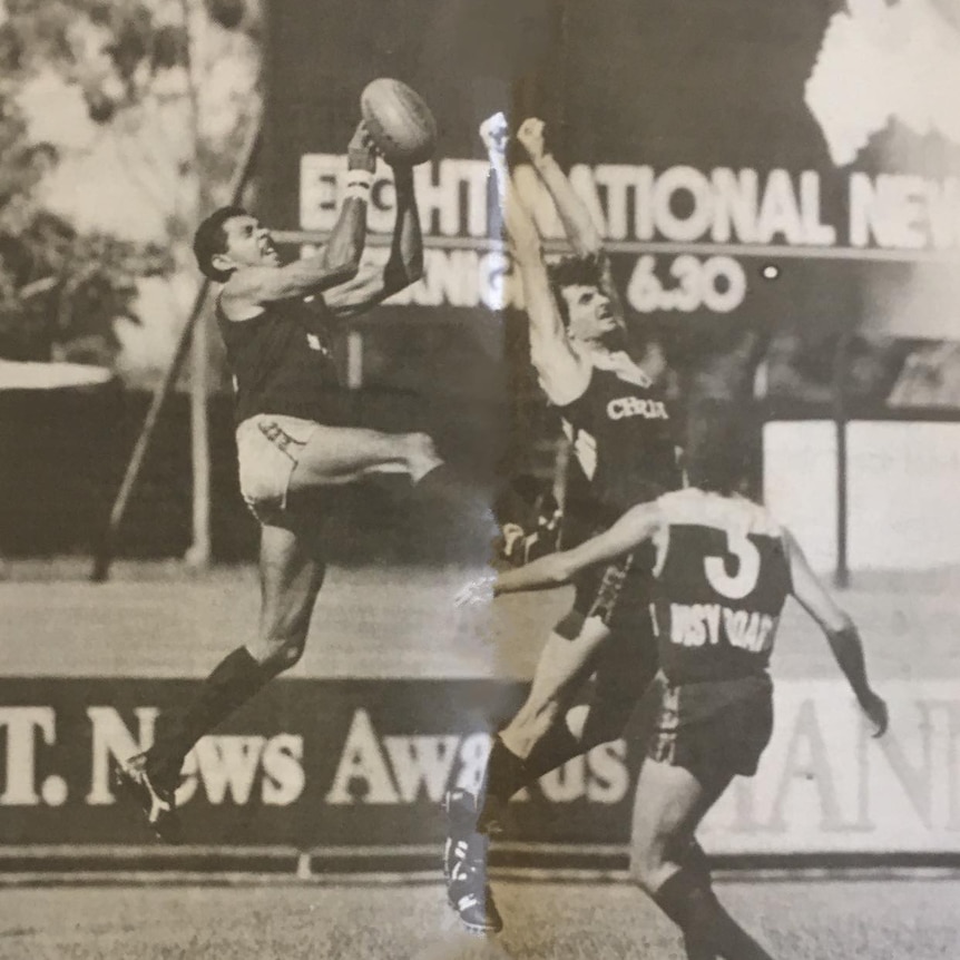 An old photo of Dennis Dunn taking a pack mark playing against the Darwin Buffaloes.