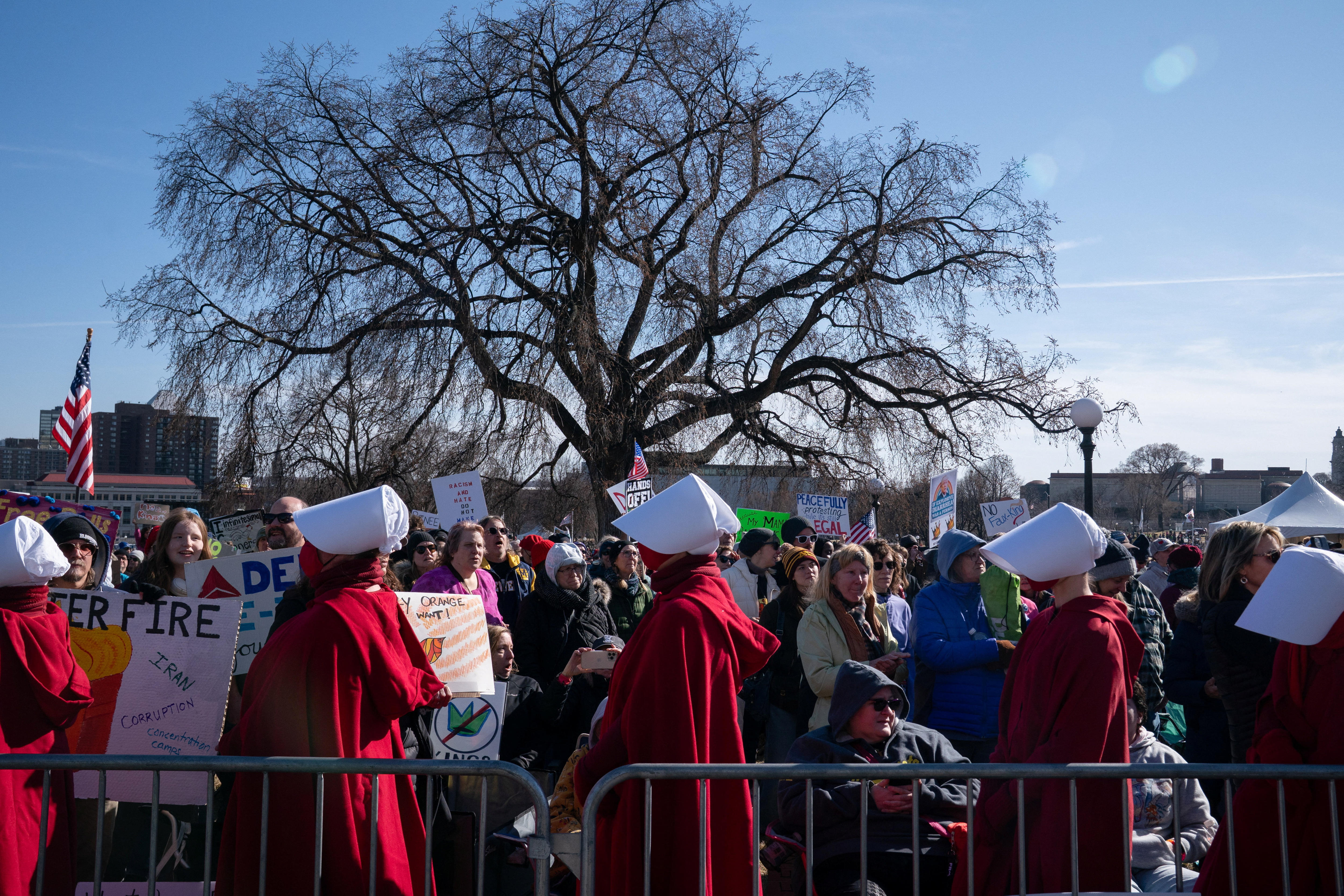 Women dressed as handmaids congregated at the Minnesota State Capitol.