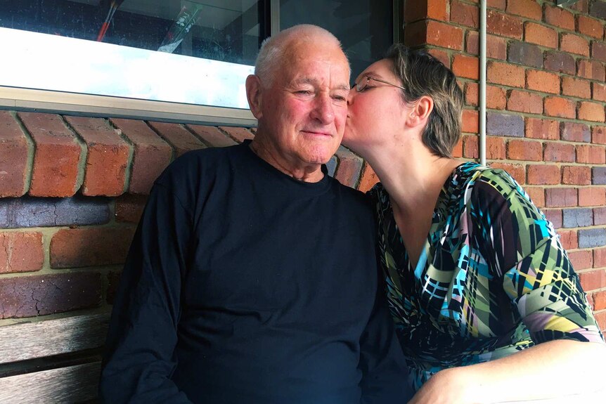 Ros Robinson kisses her elderly father Mal Longton on the cheek
