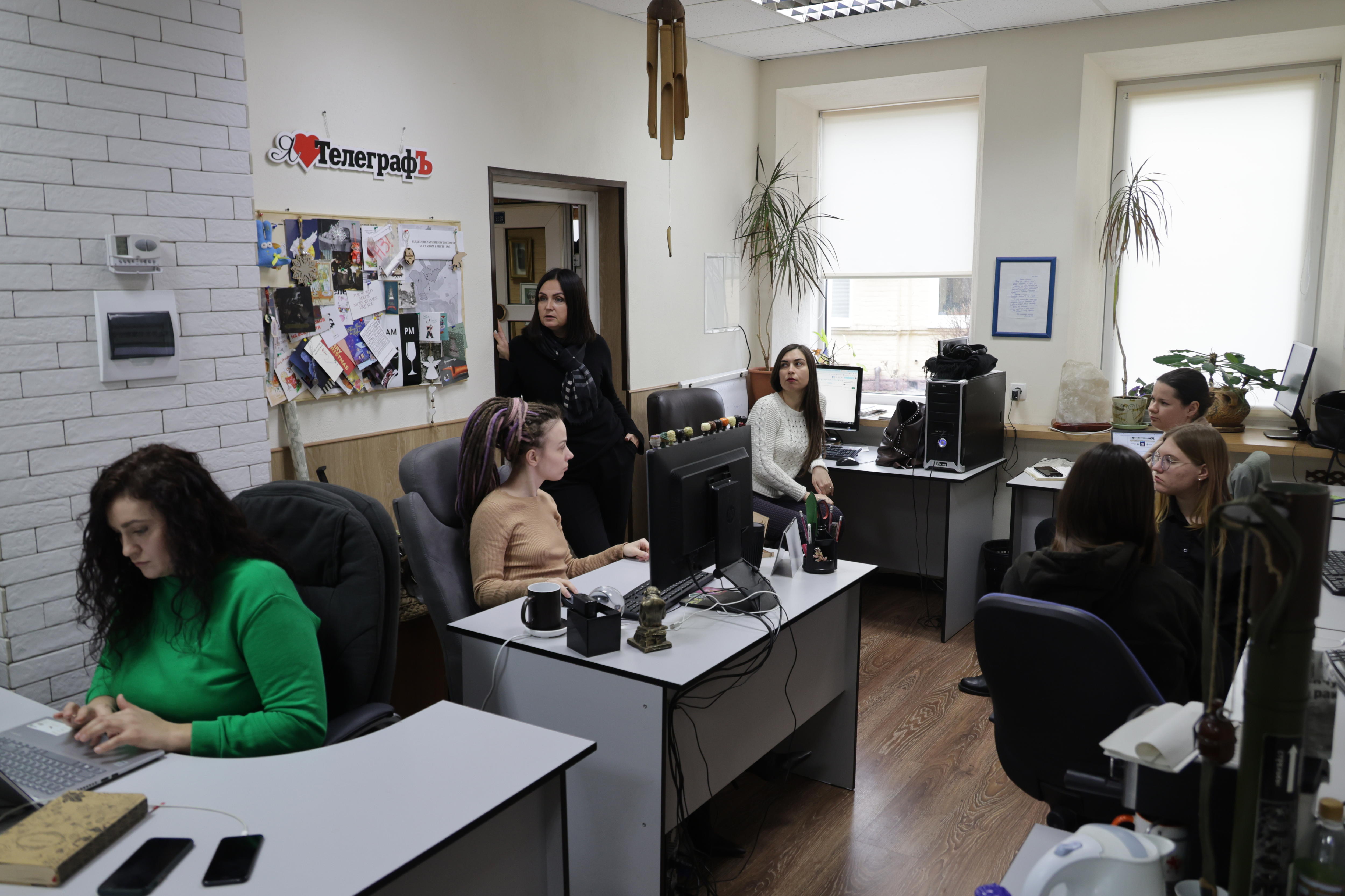 Women in a newsroom.