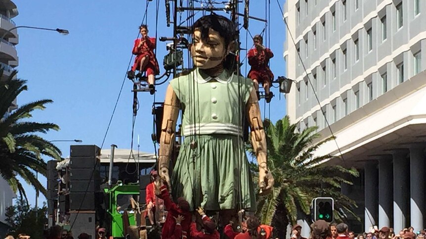 Giant marionette walks through Perth streets