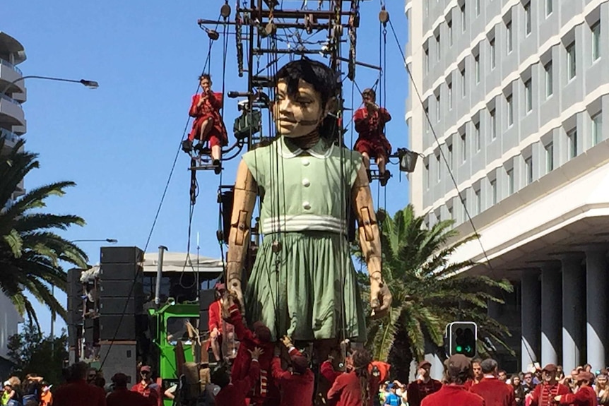 Giant marionette walks through Perth streets