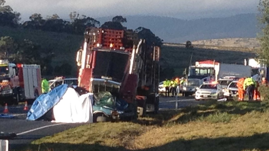 A collision between a log truck and a car has claimed two lives.