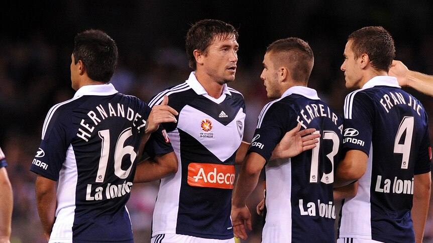 Defensive priority ... Harry Kewell directs the Victory wall (Joe Castro: AAP Image)
